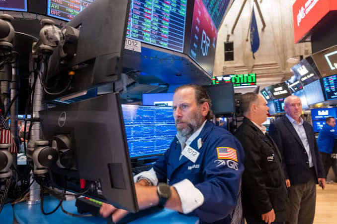 Charts and market data on a desk during an economic slowdown